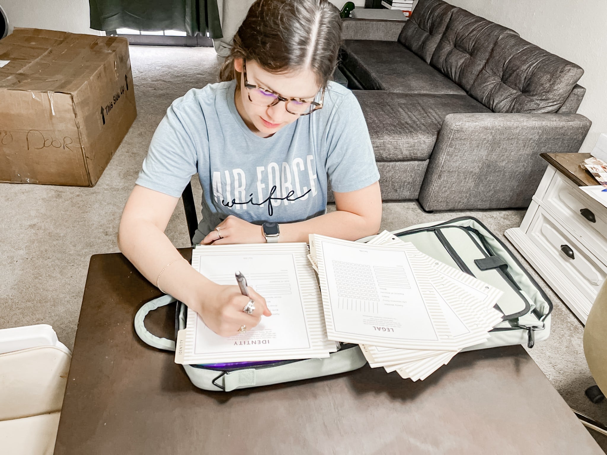 Military spouse working on PCS binder